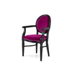 Luxury Chandelle armchair with a classic black frame and vibrant magenta velvet.