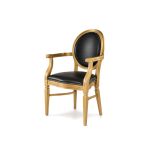 Luxury gold Chandelle armchair showcasing a premium black leather seat and backrest.