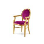 Chandelle luxury armchair with a polished gold frame and vivid magenta velvet.