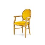 Chandelle armchair with metallic gold frame and bright yellow velvet seat and back.