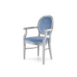 Silver framed Chandelle armchair featuring a dusty blue velvet seat and oval backrest.