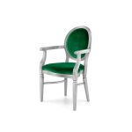 Elegant silver Chandelle armchair featuring pristine emerald green velvet seat and backrest.
