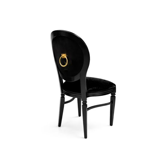 Black Chandelle chair with oval back and gold ring accent, sleek vintage-style banquet chair for weddings and formal events