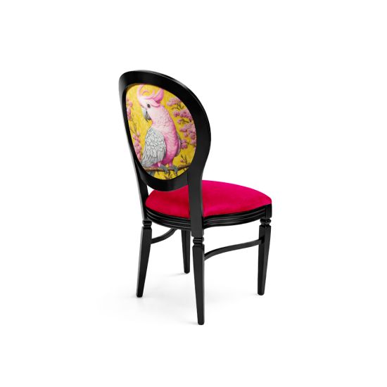 Black Chandelle chair featuring an oval floral back in yellow and pink tones with a vibrant pink upholstered seat, elegant vintage-style banquet chair for weddings and formal events