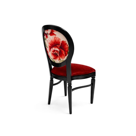 Black Chandelle chair with oval floral back and red upholstered seat, elegant vintage-style banquet chair for weddings and formal events