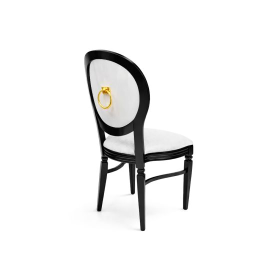 Black Chandelle chair with oval back and gold ring accent, sleek vintage-style banquet chair for weddings and formal events