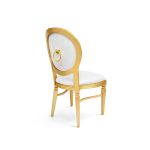 Gold Chandelle chair with oval clear back and light upholstered seat, elegant vintage-style banquet chair for weddings and formal events