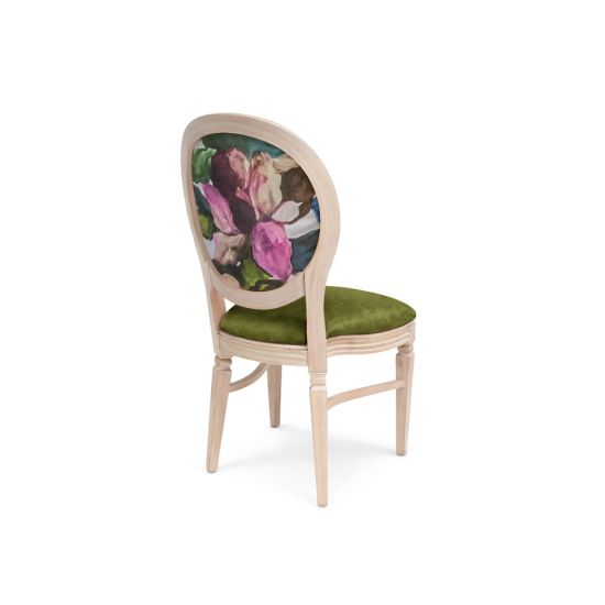 Natural Chandelle chair with oval floral back and green upholstered seat, elegant vintage-style banquet chair for weddings and formal events