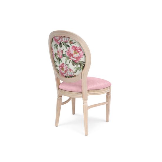 Natural Chandelle chair with oval floral back and blush upholstered seat, elegant vintage-style banquet chair for weddings and formal events