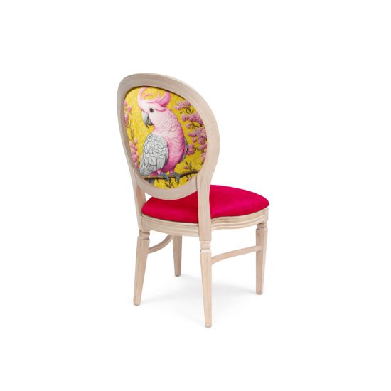 Natural Wood Chandelle chair featuring an oval floral back in yellow and pink tones with a vibrant pink upholstered seat, elegant vintage-style banquet chair for weddings and formal events