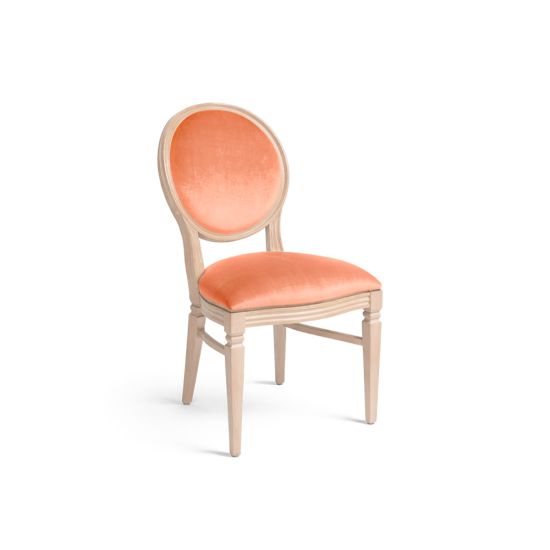 Natural Chandelle chair with oval floral back and coral upholstered seat, elegant vintage-style banquet chair for weddings and formal events