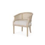French country side chair with natural wood frame, cane back and sides, and beige upholstered seat, vintage seating for weddings and events..