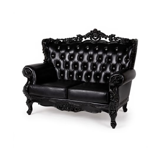 Black Empress tufted loveseat with ornate carved frame and high back, elegant lounge seating rental for weddings, galas, and events.