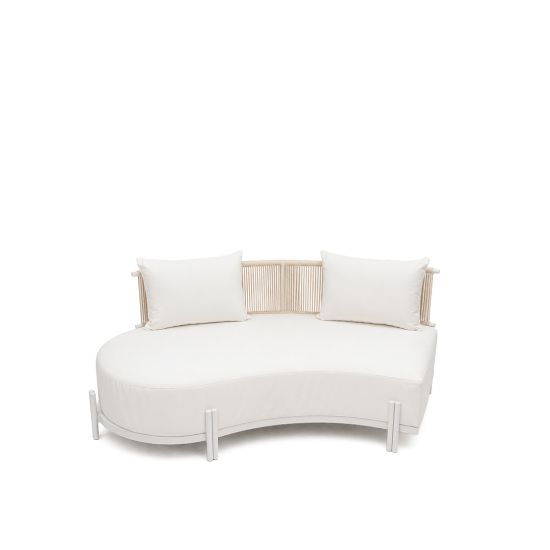 Laguna Crescent left curved sofa with ivory upholstery, rope-woven backrest, white frame, and two accent pillows.