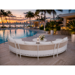 Laguna Crescent curved sofa with ivory upholstery, rope-woven backrest, white frame, and three accent pillows.