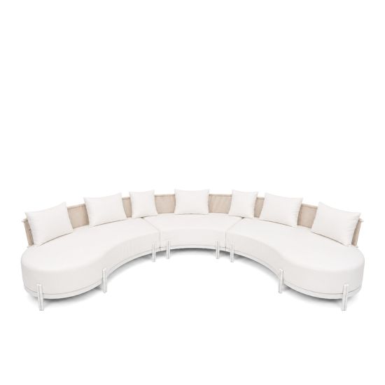 Laguna Crescent 3-piece curved sofa with ivory upholstery, rope-woven backrests, white frame, and seven accent pillows.