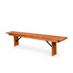Rustic chestnut wood bench with long plank seat and sturdy legs, farmhouse bench rental for weddings, ceremonies, and events.