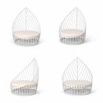 White leaf chair with sculptural open leaf frame and seat cushion, modern accent chair rental for weddings and event lounges.