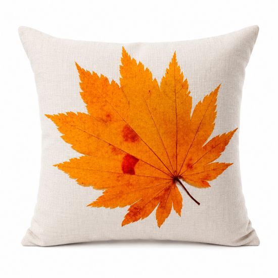 Neutral linen-style throw pillow with orange maple leaf print, warm autumn accent cushion for fall weddings and lounge décor styling.