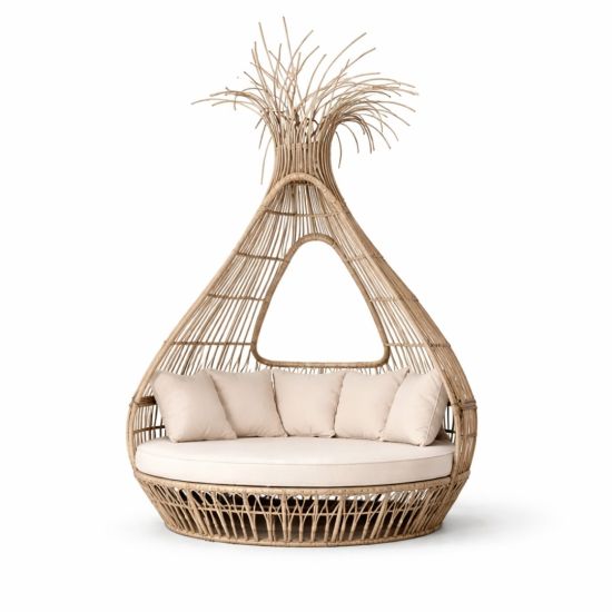 Bohemian wicker bed with teardrop canopy frame and cream cushion, statement lounge bed rental for boho weddings and outdoor events.