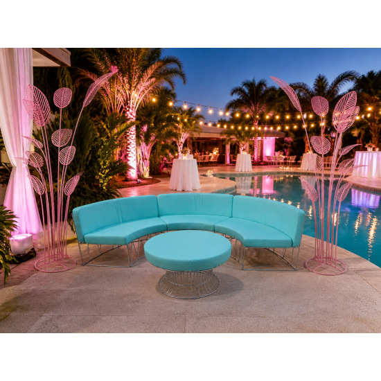 Modern curved lounge chair with white wire frame and light pink upholstered cushion