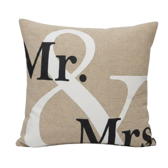 Beige throw pillow with “Mr & Mrs” typography in black and white, wedding-themed accent cushion for sweetheart lounge décor styling.