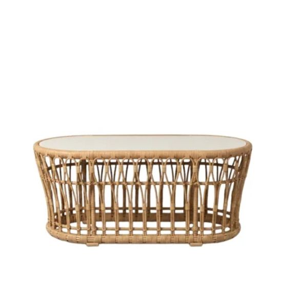 Oval rattan coffee table with open-weave frame and smooth top, offering a relaxed coastal and bohemian aesthetic for lounge settings