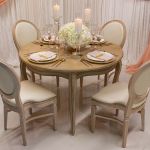 Paris round dining table with carved legs and light finish, elegant vintage-style event dining table for weddings and receptions