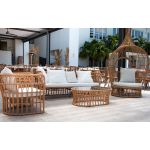 Oval rattan coffee table with open-weave frame and smooth top, offering a relaxed coastal and bohemian aesthetic for lounge settings
