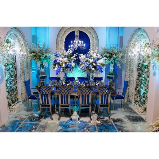 Silver metal Celine banquet chair with Royal Blue upholstered seat cushion for luxury event seating