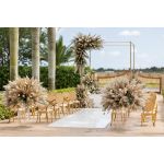 Gold oval-back event chair with polished metal frame and White upholstered seat, modern luxury seating ideal for weddings and upscale receptions.