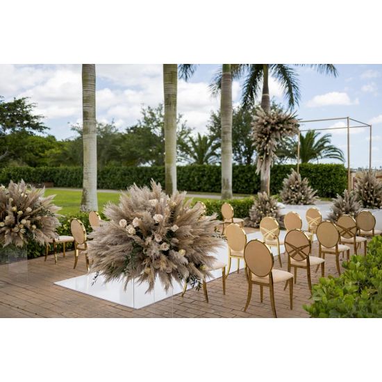 Gold oval-back event chair with polished metal frame and White upholstered seat, modern luxury seating ideal for weddings and upscale receptions.