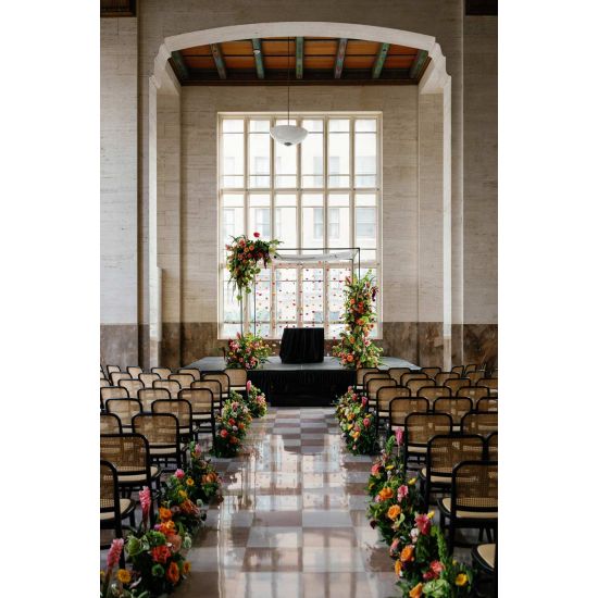 “Black-frame Broadway Chair with natural rattan woven back and seat on slender curved legs, elegant event guest seating”