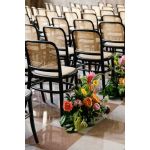 “Black-frame Broadway Chair with natural rattan woven back and seat on slender curved legs, elegant event guest seating”