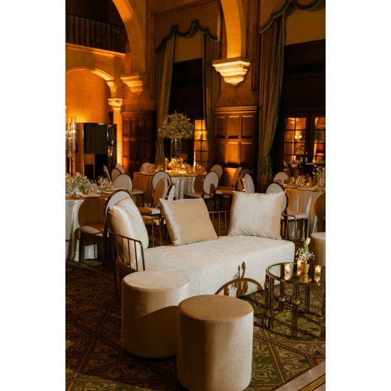 Emerald velvet Reflection accent sofa with three cushions and gold metal bar arms, modern luxury lounge seating for weddings and events.