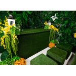 Green artificial-grass panel front event bar rental unit with light top “Grass Collection” garden-style bar configuration.