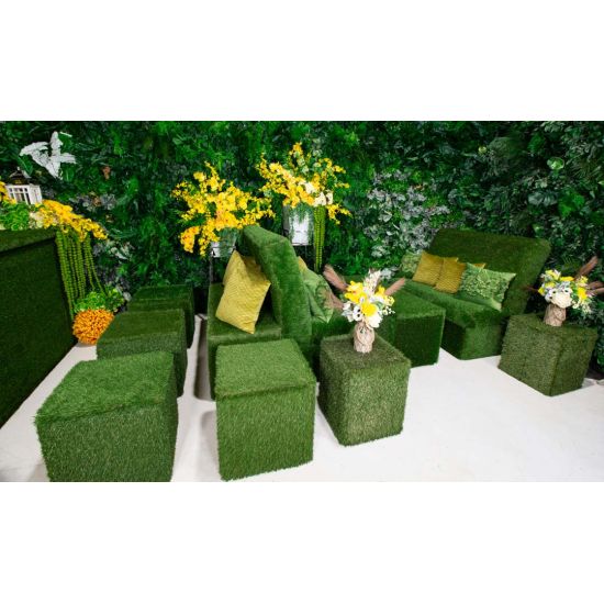 Lush green artificial living wall with mixed foliage and textured greenery, botanical backdrop panel for weddings, photo ops, and events.