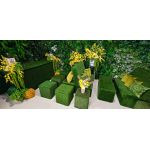 Lush green artificial living wall with mixed foliage and textured greenery, botanical backdrop panel for weddings, photo ops, and events.