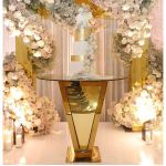 72 inch round glass-top high boy cocktail table with inverted-pyramid gold metal base from Reflection collection for upscale event rental
