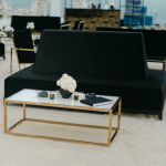 Gold stainless steel Splendor coffee table with minimalist rectangular top and sleek luxury finish for contemporary event lounge décor