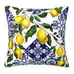 White throw pillow with blue Mediterranean tile pattern and yellow lemon branches, coastal Italian-inspired accent cushion for event lounge décor.