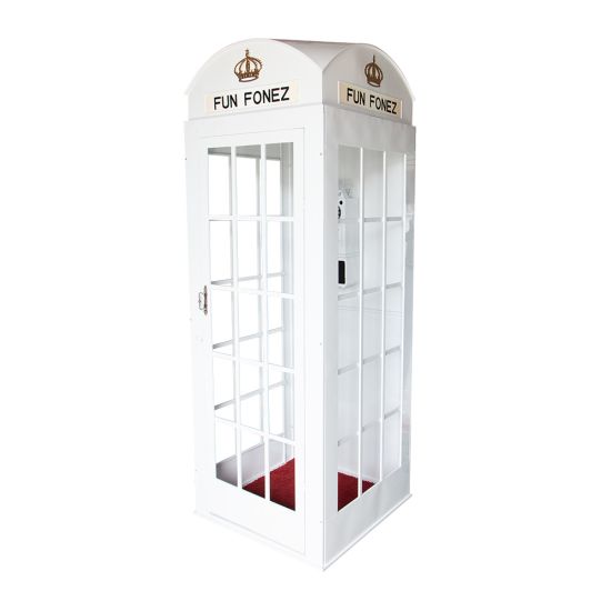 White luxury telephone booth with glass panel doors and red interior flooring, photo booth-style wedding rental.