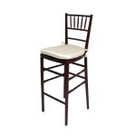 Mahogany Chiavari bar stool with high spindled back and Ivory cushion, dark-wood resin event-height seating ideal for bar setups