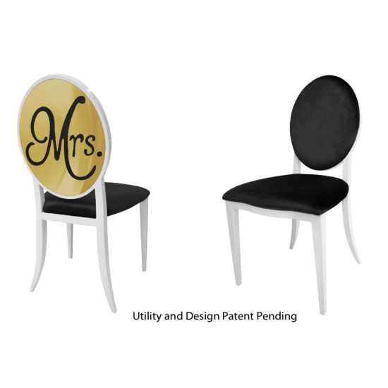 White framed “Mrs. Chair” armless event chair with sleek stainless‐steel finish and black velour cushion seat, designed for weddings and upscale events.