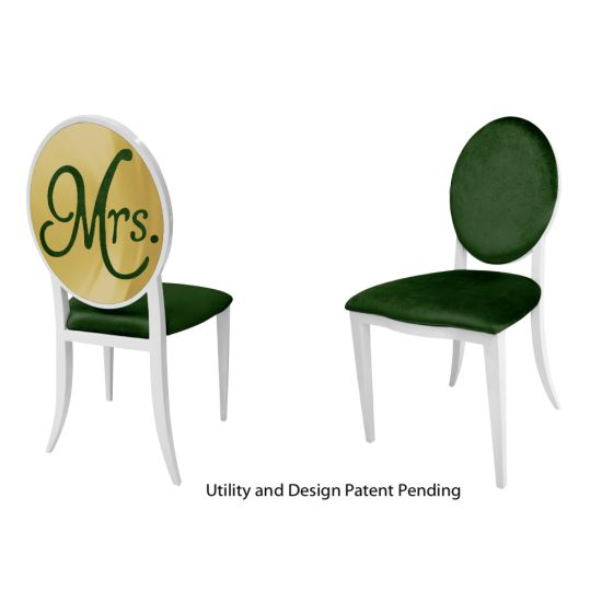 White framed “Mrs. Chair” armless event chair with sleek stainless‐steel finish and Emerald Green velour cushion seat, designed for weddings and upscale events.