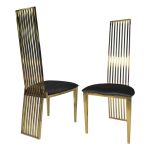 Tall gold metal event chair with vertical slat high back and black cushioned seat, modern luxury seating ideal for weddings and upscale receptions.