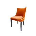 Black-leg Isabello chair with orange velvet cushioned seat and tall modern backrest, premium event dining seating