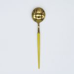 Gold dinner spoon with yellow handle, stylish flatware for catered events, celebrations, and polished tablescapes.