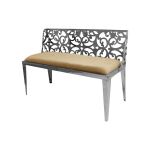 Reflection laser-cut loveseat with silver metal scrollwork back and Champagne velvet seat cushion, modern luxury seating for weddings and events.