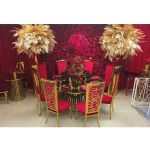 Gold stainless-steel Reflection Bohemian cocktail table with slender rod base and 30″ diameter round top, ideal for modern lounge event décor